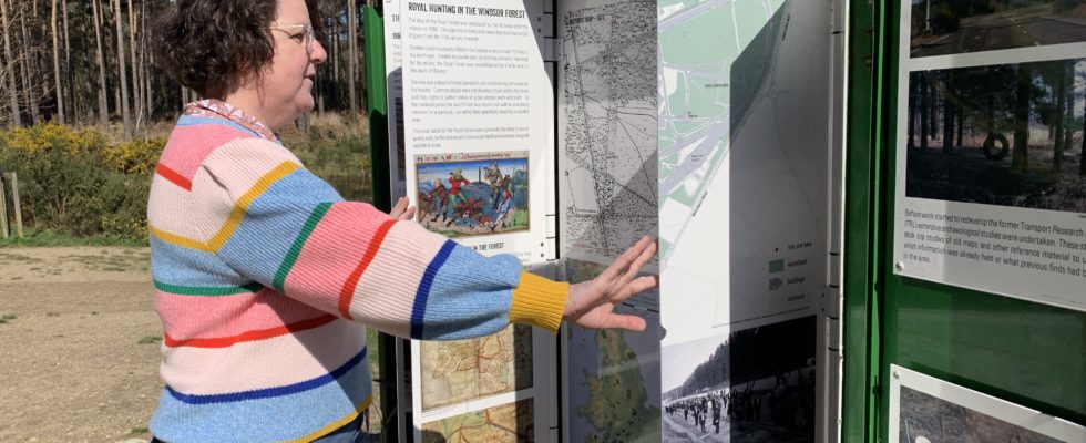 Photo of a person reading about site history in the mini museum.